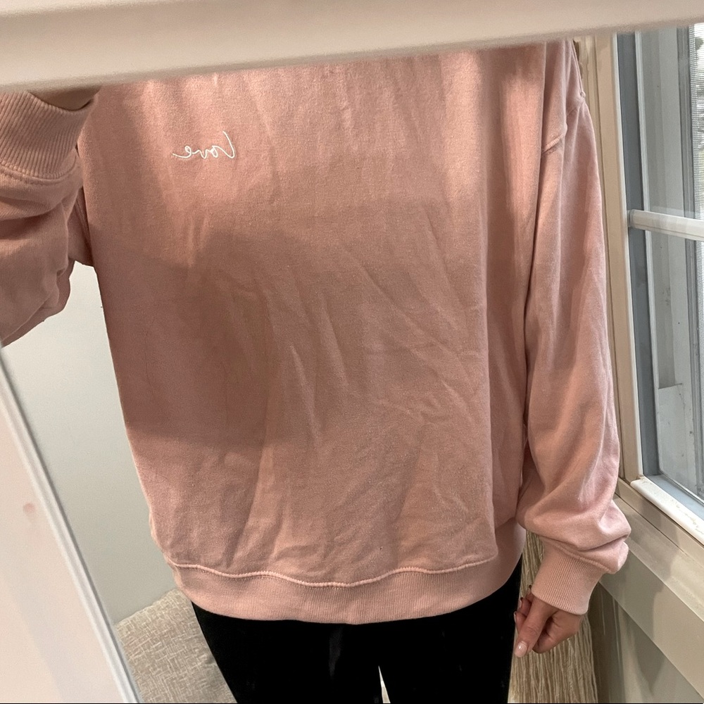Pink crewneck with LOVE written on the chest